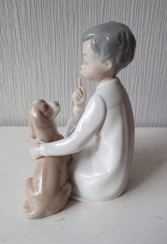 Image 1 of Authentic Lladro "Boy with dog" - porcelain figurine 20 cm
