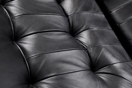 Image 1 of Poltrona girevole e pouf in pelle nera danese moderna vintage di metà secolo di Unico, anni '70, set di 2