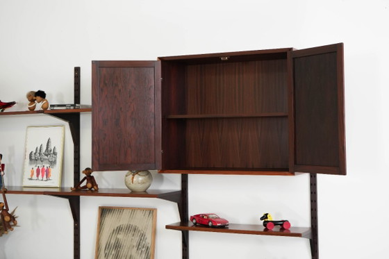 Modulaire stellingen van palissanderfineer van Poul Cadovius, Denemarken, jaren 70. – Wandkast, Mdf (photo 18 of 27)