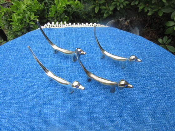 Image 1 of 4 Silver Plated Knife Rests Dachshund Dog Long Tail Blue Eyes vintage