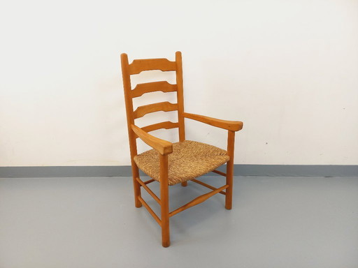 Vintage fauteuil van beukenhout en stro uit de jaren 50.