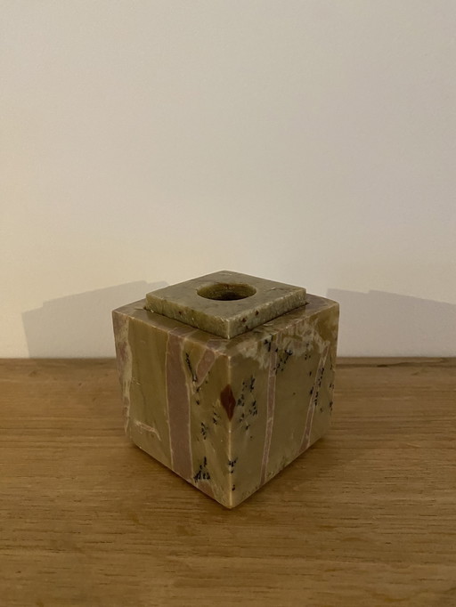 Sturdy vintage marble candlestick in cube shape.