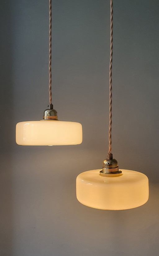 Vintage pendant lamp set (2) of yellow pastel opaline glass. Art Deco design.