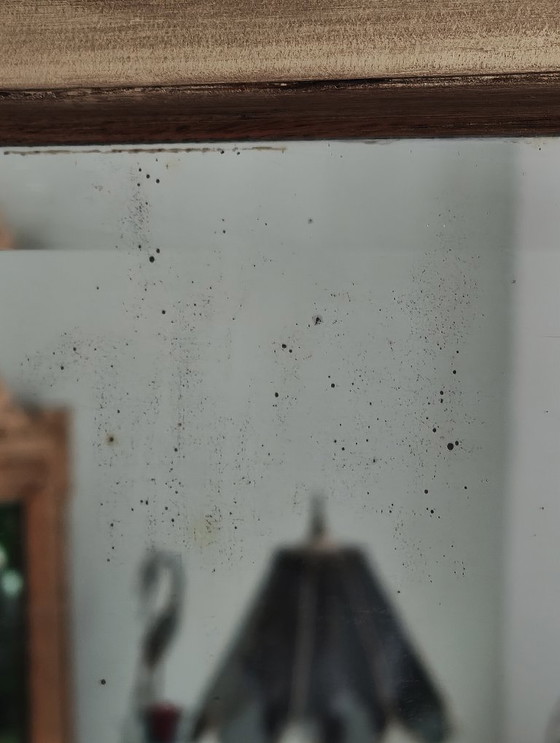 Image 1 of Gilded wooden mirror with carved pediment in the trumeau style