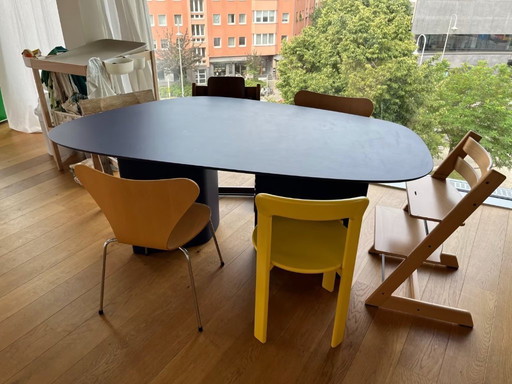 Dining table in organic shape: dark blue