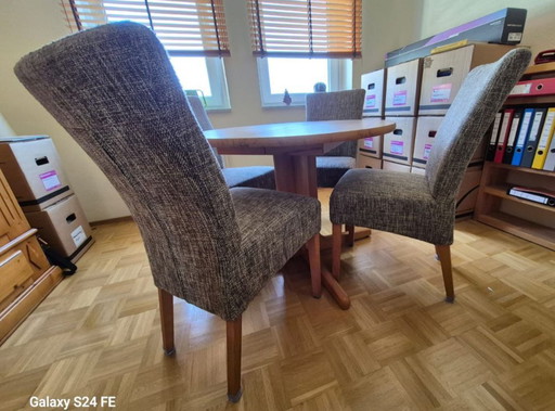 Mesa de comedor de madera maciza redonda y plegable.