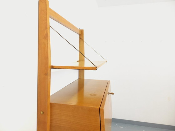 Image 1 of Wall-mounted bookcase with vintage light wood and brass secretary bar, dating from the 1960s