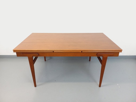 Image 1 of Vintage Scandinavian rectangular dining table by Ejvind A. Johansson from the 50s and 60s in teak with integrated extensions
