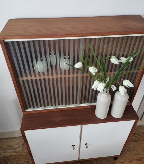 Image 1 of Set of two vintage cabinets with ribbed glass – warm wood & white (mid-century look)