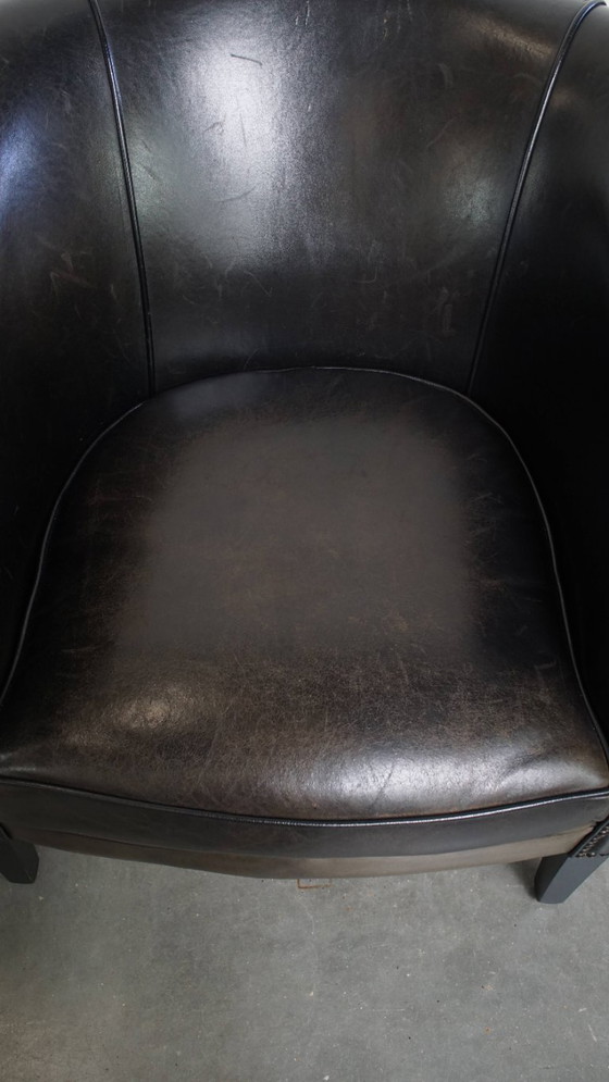 Image 1 of  Set van 2 subtiele zwart/ grijze schapenleren clubfauteuils 