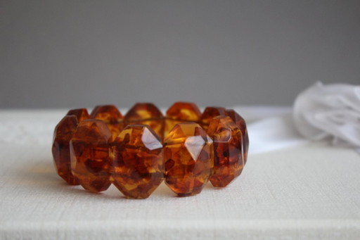 Amber bracelet, intricately cut, 46 grams of honey amber.