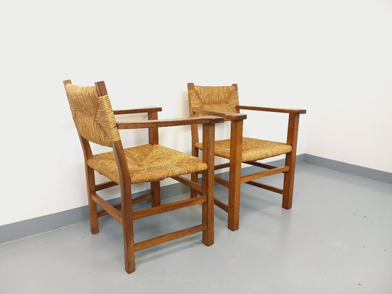 Image 1 of Suite van 2 vintage Brutalistische fauteuils in eiken en stro uit de jaren 60