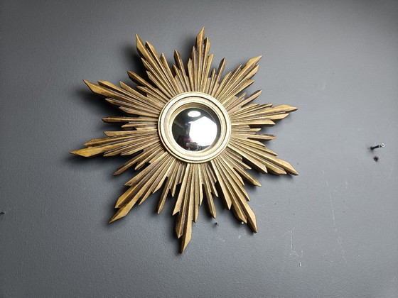 Image 1 of Beautiful resin sunburst mirror with convex mirror glass.  The golden mirror is in a good condition.  1960s - made in Belgium.  