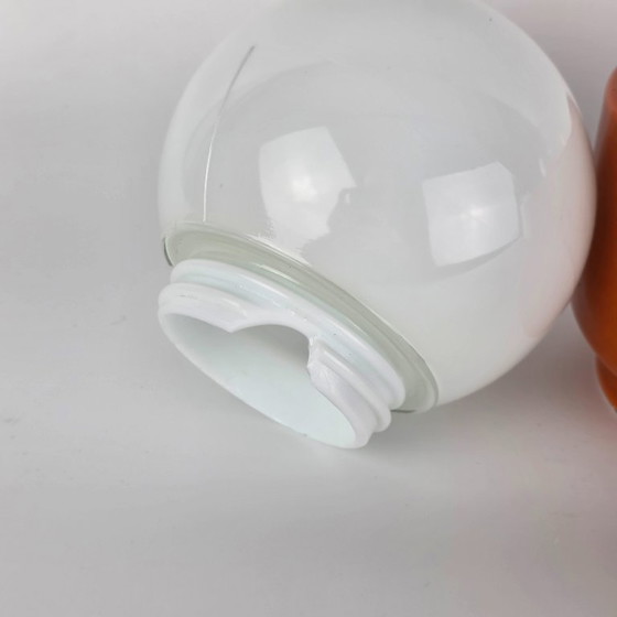 Image 1 of Vintage German ceramic lamp with a glass globe shade. Can be used as a wall lamp, table lamp, or sconce. Orange. 70s / retro