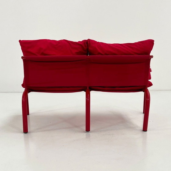 Image 1 of Rode tweezitsbank van metaal en stof van Thalia & Co, jaren 80.
