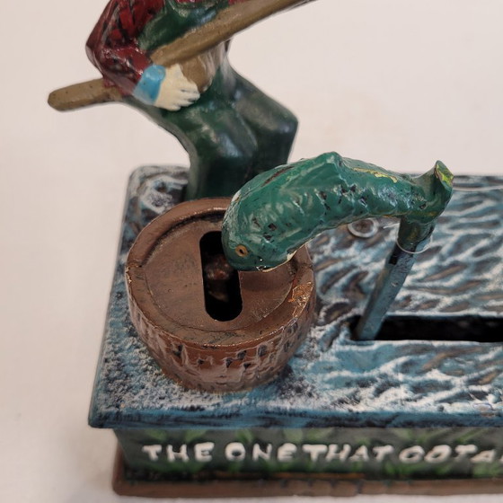Image 1 of "Fisherman" piggy bank with fishing mechanism, cast iron, 1950s - USA.