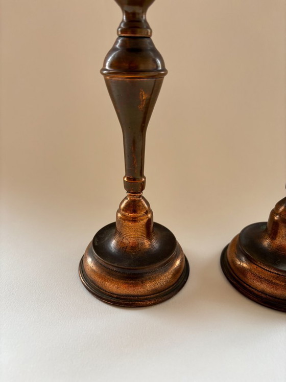 Image 1 of Een paar vintage koperen kandelaars