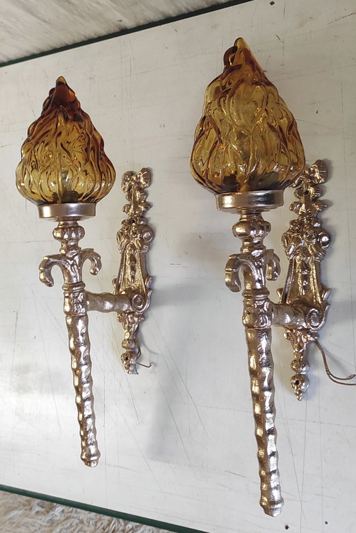 Torch-style wall sconces in gilded cast aluminum and glass - mid-20th century