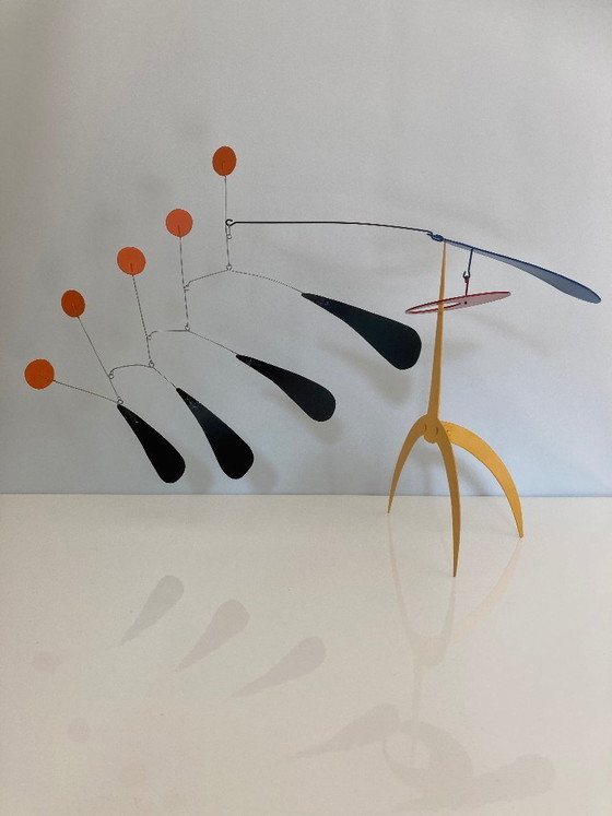 Image 1 of Yellow standing mobile with 5 orange discs