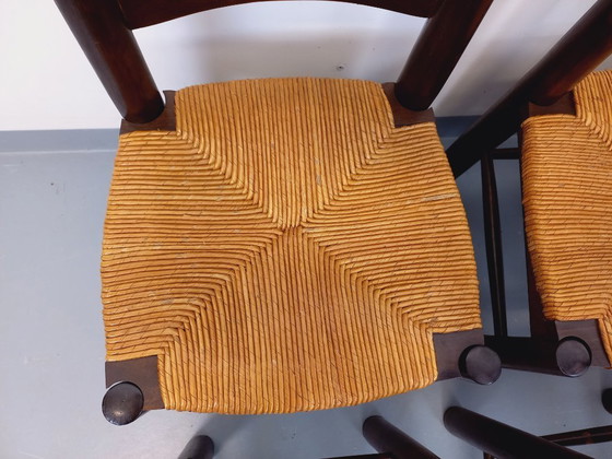 Image 1 of Set van 6 vintage brutalistische stoelen van Georges Robert, gemaakt van hout en stro, uit de jaren 50 en 60.