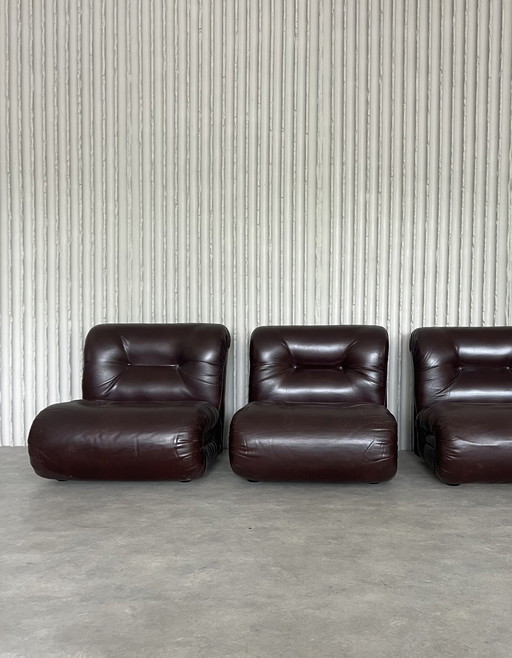 Burgundy Italian leather lounge chairs, 6 available