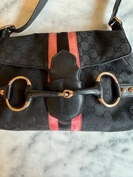 Image 1 of borsa con morsetto per cavalli