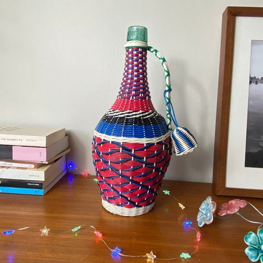 Old glass bottle and vintage plastic braiding scoubidou