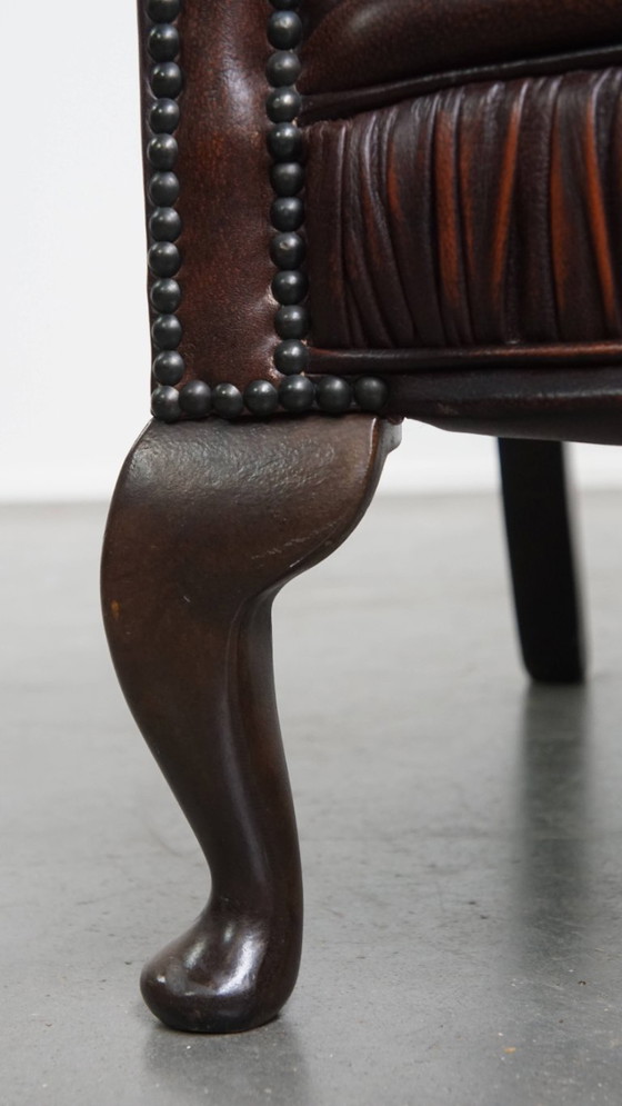 Image 1 of Bruine rundleren chesterfield oorfauteuil