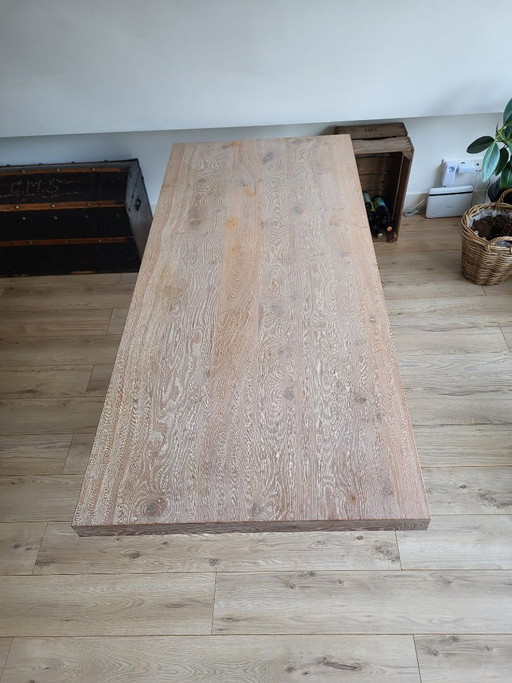 Wooden table with cast iron leg