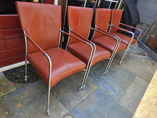 4 red leather dining chairs on wheels, brand Bert Plantagie