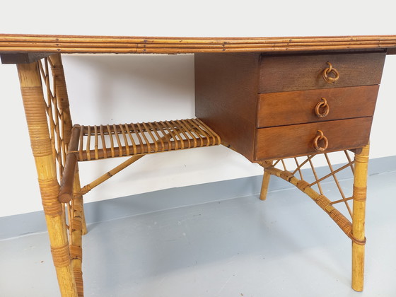 Image 1 of Vintage Louis Sognot bureau in rotan en hout uit de jaren 60