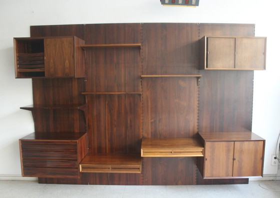 Mueble de pared en palisandro, de Poul Cadovius para Cado, Dinamarca. – Estanterías de pared, Wood (photo 7 of 17)