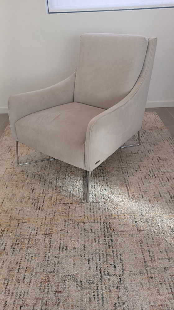 Image 1 of Natuzzi armchair with footstool