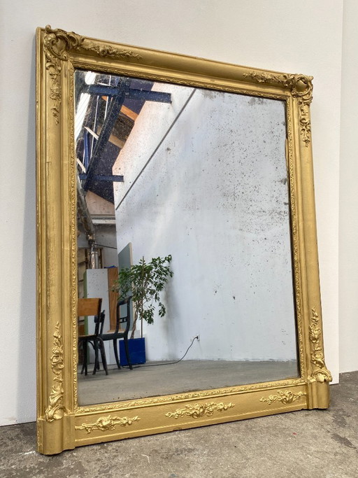 Stuccoed and gilded wooden mirror, 110cm high, 19th century, France