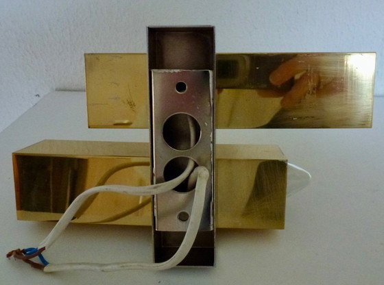 Image 1 of A brass wall lamp, in a minimalist, geometric style, from the middle of the last century.