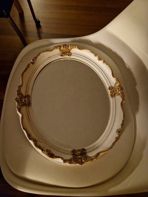 Antique, oval wall mirror