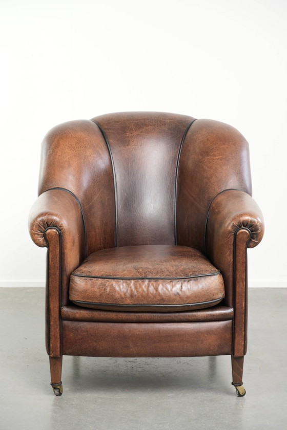 Characterful and comfortable vintage sheepskin armchair with a unique design and a timeless look – Leather (photo 2 of 15)