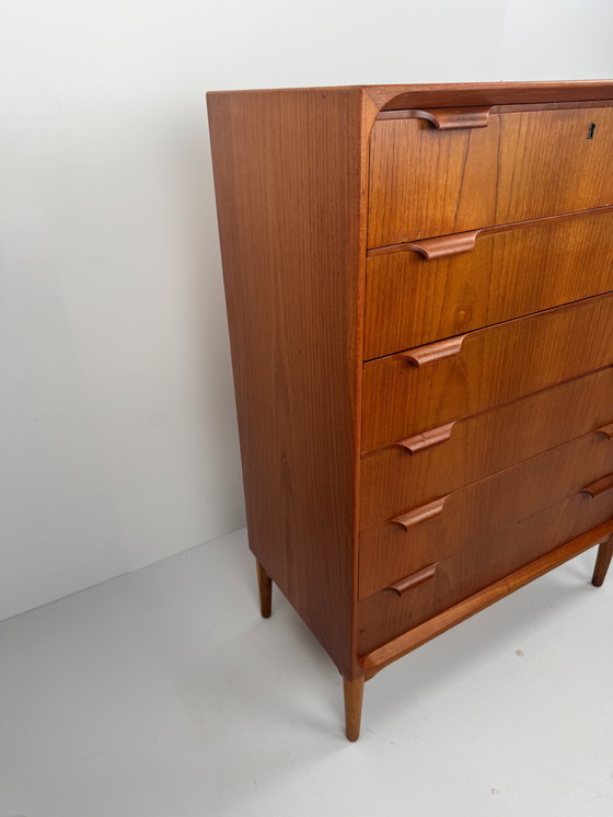 Image 1 of Scandinavian Mid-Century Teak Chest of Drawers – Elegant Sculpted Details