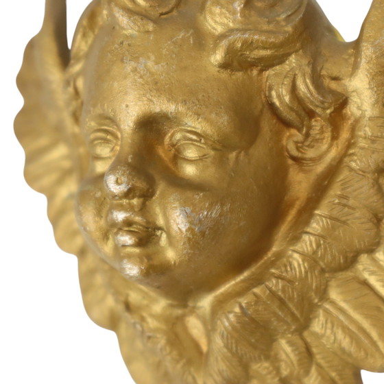 Image 1 of Teste d'angelo in metallo dorato
