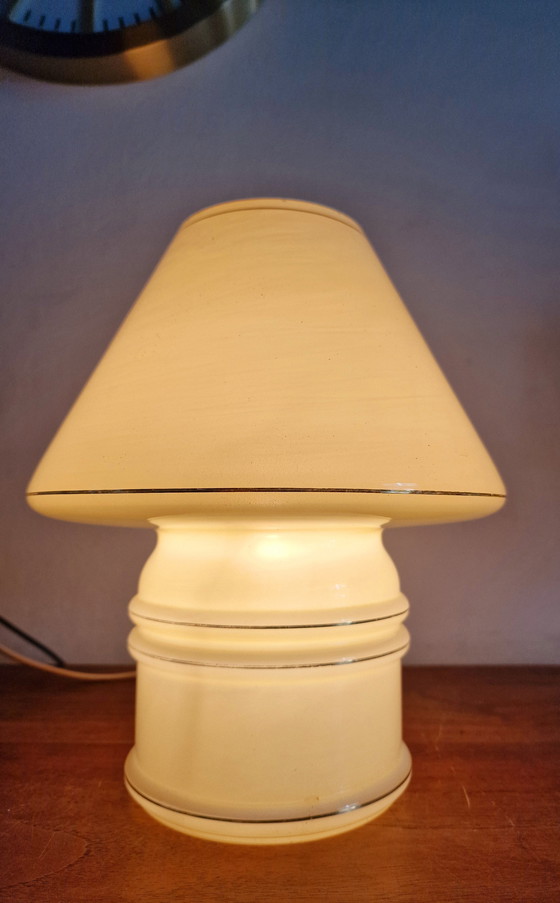 Image 1 of Vintage table lamp by Massive, with a glass base and shade.

With gold accents
