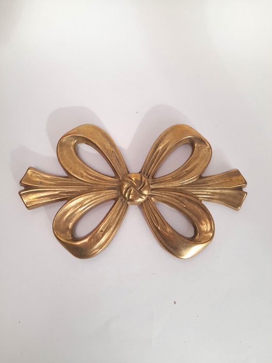 Image 1 of Salvamanteles de latón con doble nudo