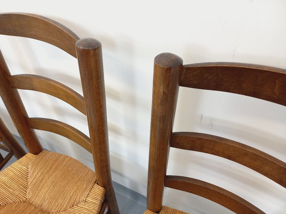 Image 1 of Set van 4 vintage brutalistische stoelen van hout en stro uit de jaren 60.