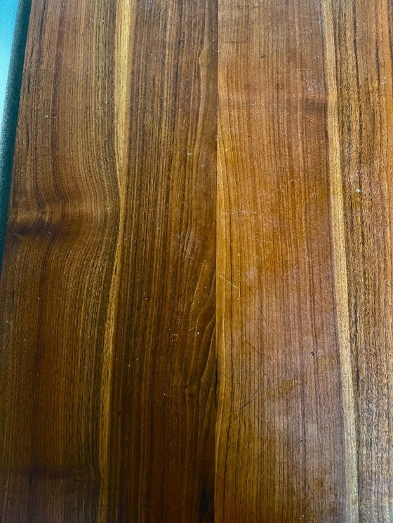 Image 1 of Tavolo “The Bridge” in noce con gambe in acciaio inox