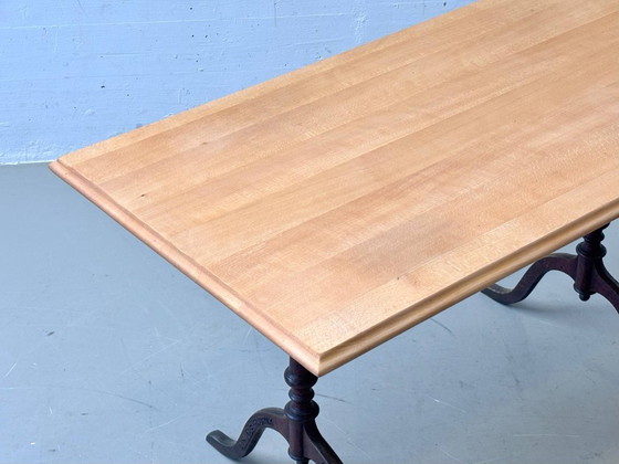 Image 1 of Horgen Glarus baraktafel gemaakt van beukenhout met gietijzeren poten