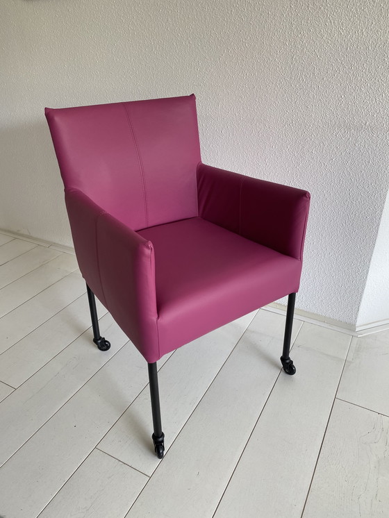 Image 1 of Luxurious fuchsia leather dining chairs with wheels