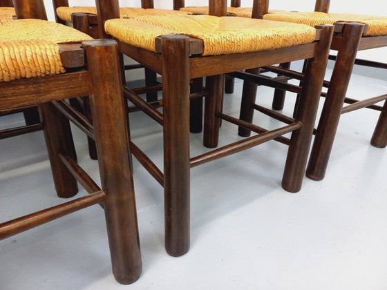 Image 1 of Set van 6 vintage brutalistische stoelen van Georges Robert, gemaakt van hout en stro, uit de jaren 50 en 60.