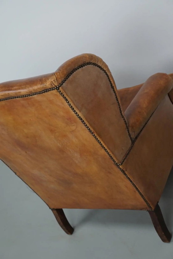 Image 1 of Vintage Nederlandse cognackleurige leren clubfauteuil met voetenbank