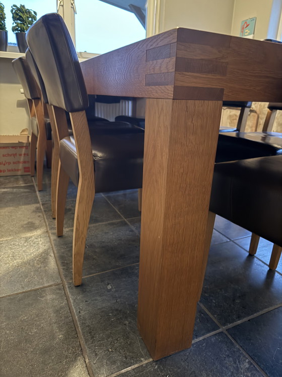 Image 1 of Wooden table with 8 chairs