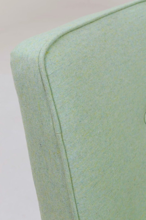 Image 1 of Scandinavische fauteuil met pistachekleurige pastel wollen stof en eikenhout