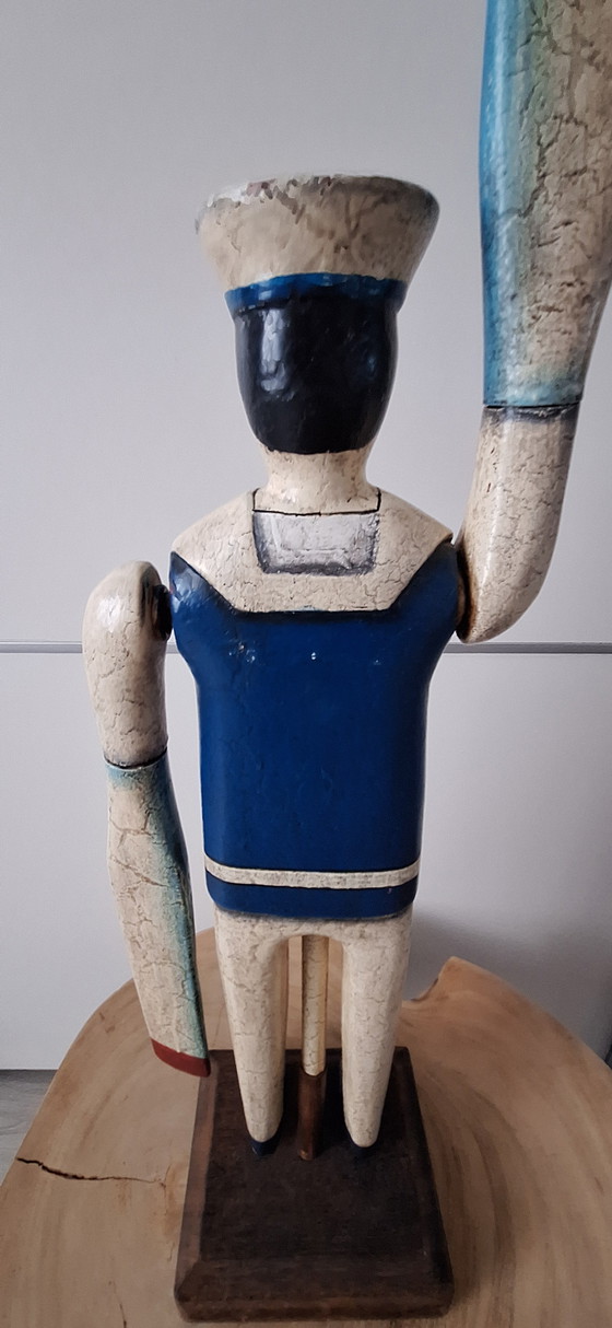 Image 1 of Antieke matroos met roeispanen als armen